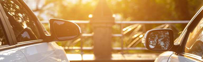 Suntamers 2026 | Two cars sitting in the sunlight with auto tinting